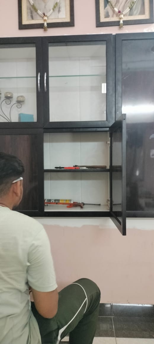 Finished glass-shutter wall cabinet installed for a client